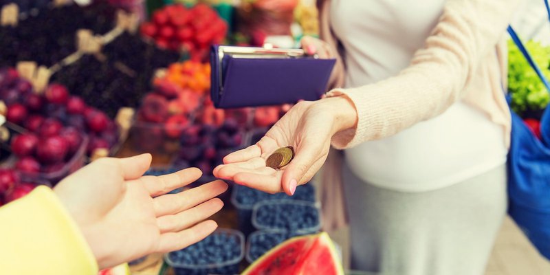 market-coin-lady-hand-HEADER-shutterstock-45552.original