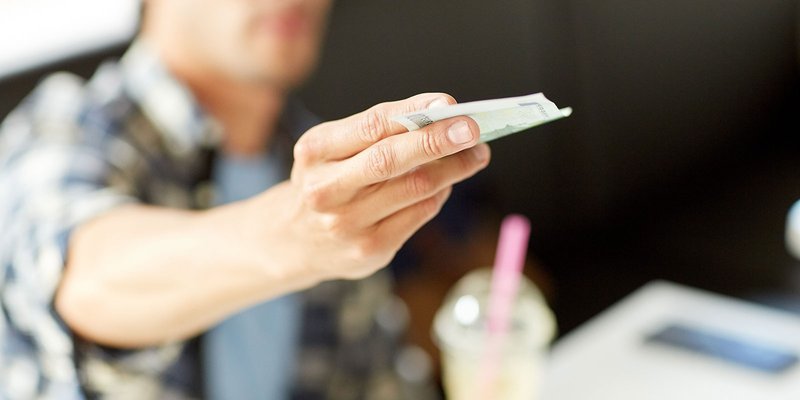 American-dollar-man-hands-HEADER-shutterstoc.max-800x600