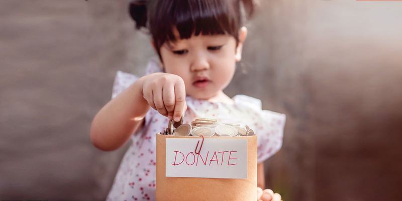 Girl-coins-donate-HEADER-shutterstock-101991328.original