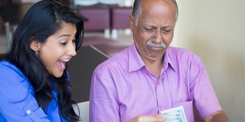Indian-old-man-young-woman-cash-HEADER-shutters.original