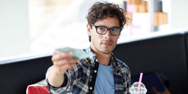 Man-glasses-cash-HEADER-shutterstock_485663818.original