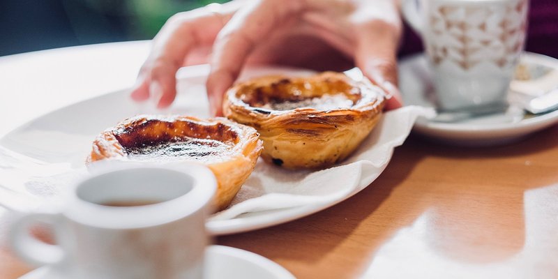 Portuguese-pastries-hand-HEADER-shutterstock-11.original