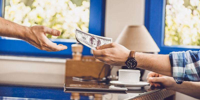 US-dollars-hands-cafe--HEADER-439049515-.original