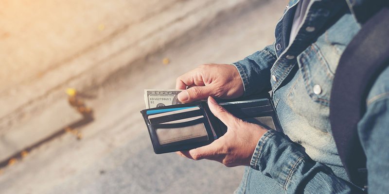 US-dollars-wallet-HEADER-shutterstock_610291364.original