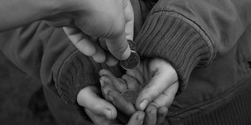 child-hands-coins-HEADER-shutterstock_152077557.original