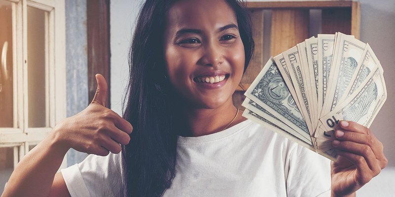girl-thumbs-up-american-cash-HEADER-shutterstoc.original