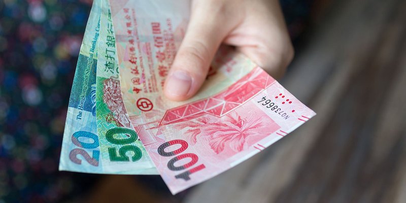 hong-kong-cash-hand-HEADER-shutterstock-1396035.original
