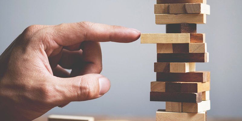 jenga-hand-HEADER-shutterstock_412750792.original