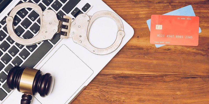 laptop-gavel-cards-handcuffs-HEADER-shutterstoc.original