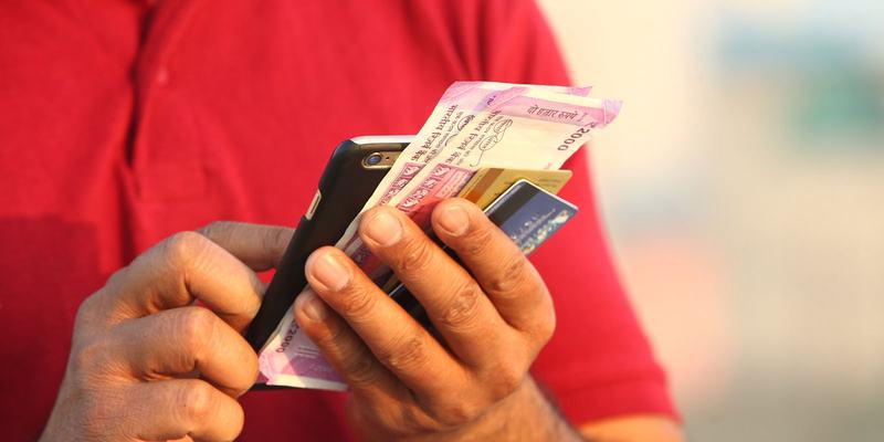 phone-cash-cards-red-shirt-HEADER-shutterstock_.original