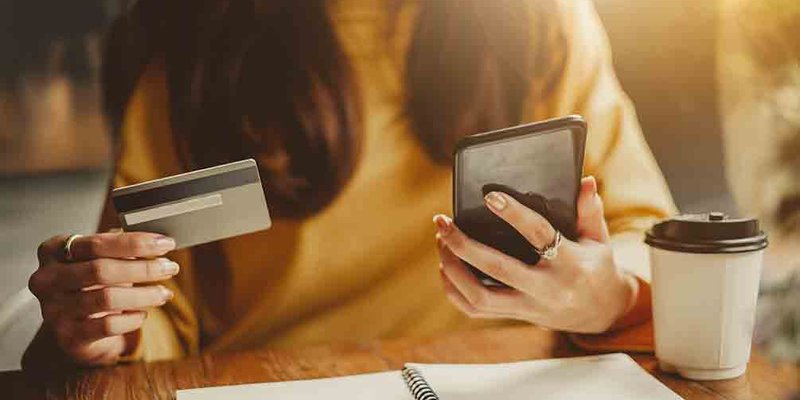 woman-hands-phone-card-HOME-BANNER-shutterstock.original